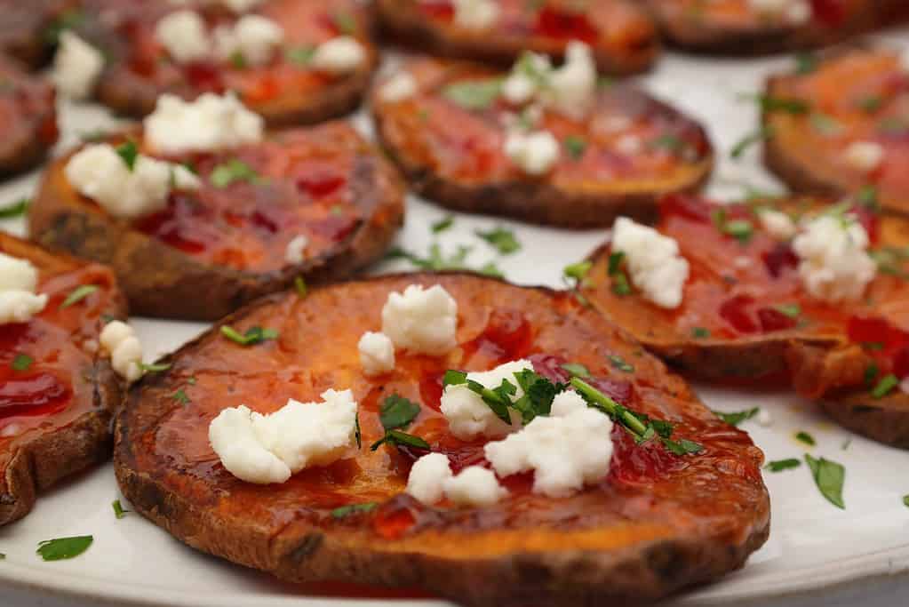 Sweet Potato and Goat Cheese Appetizer bites are baked in the oven for a healthy and easy festive holiday appetizer-perfect for Christmas or Thanksgiving!