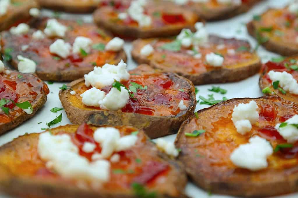 Sweet Potato and Goat Cheese Appetizer bites are baked in the oven for a healthy and easy festive holiday appetizer-perfect for Christmas or Thanksgiving!
