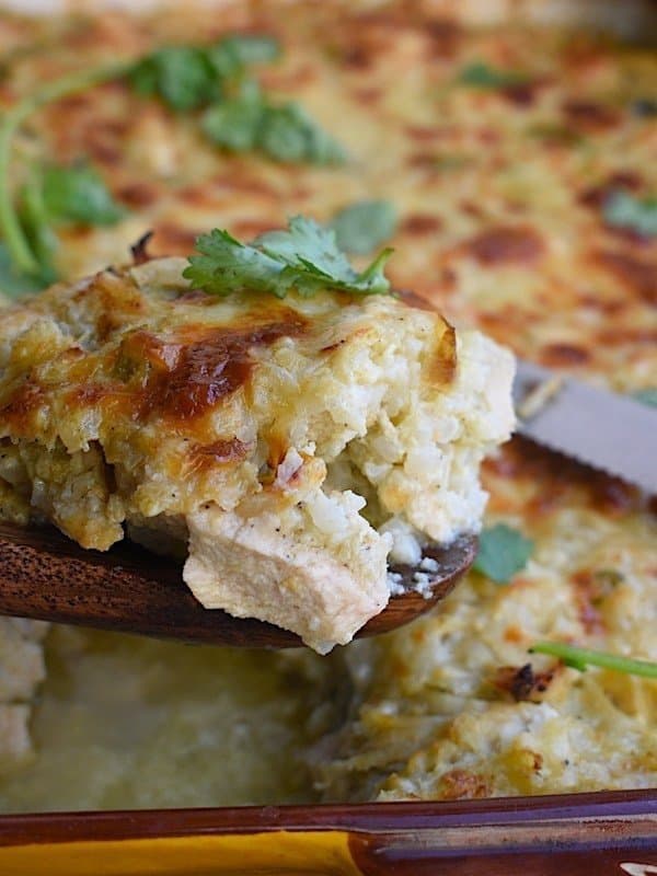 Chicken Chile verde cauliflower rice casserole is made with a base of cauliflower rice and combines classic flavors of chicken Chile verde: salsa, and cilantro in a creamy sauce.